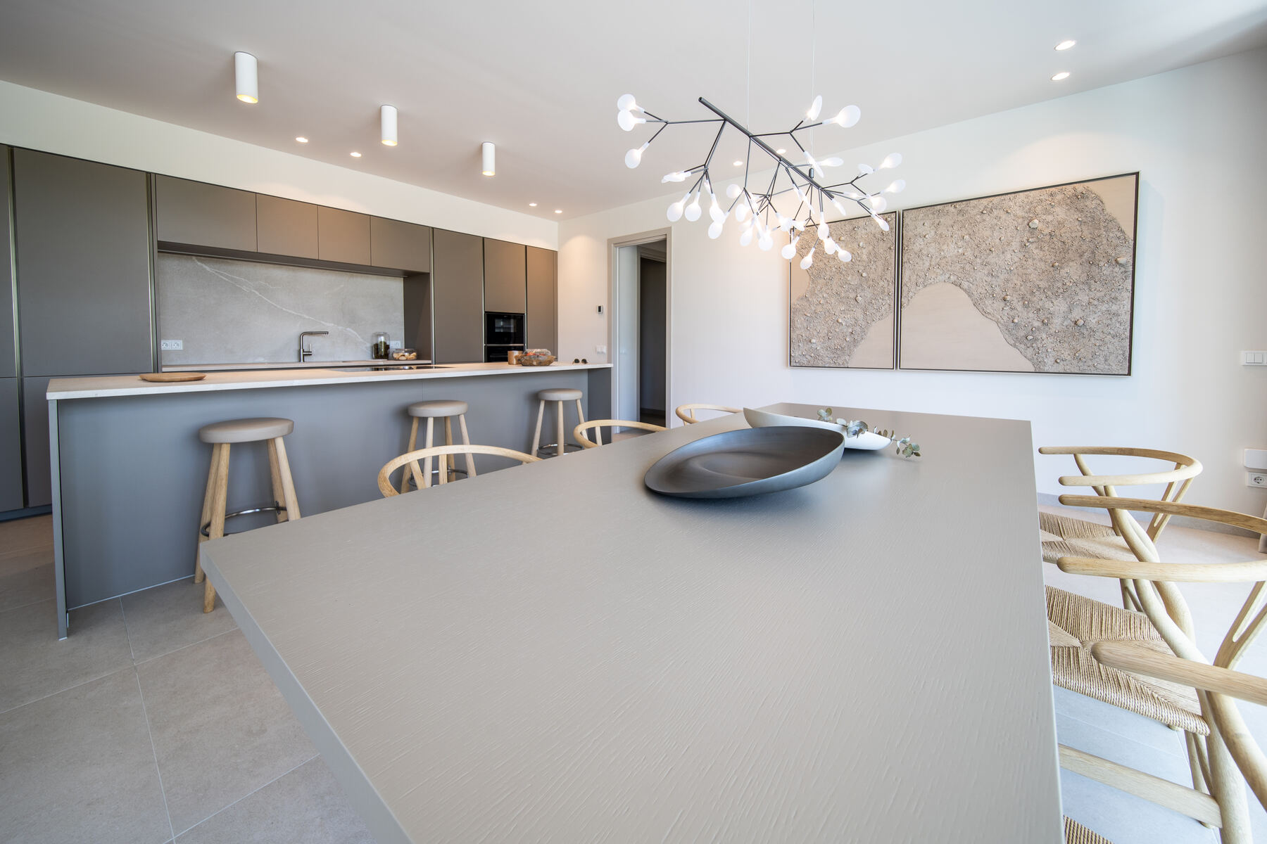 Minimal kitchen island with integrated appliances in a contemporary Mallorca villa