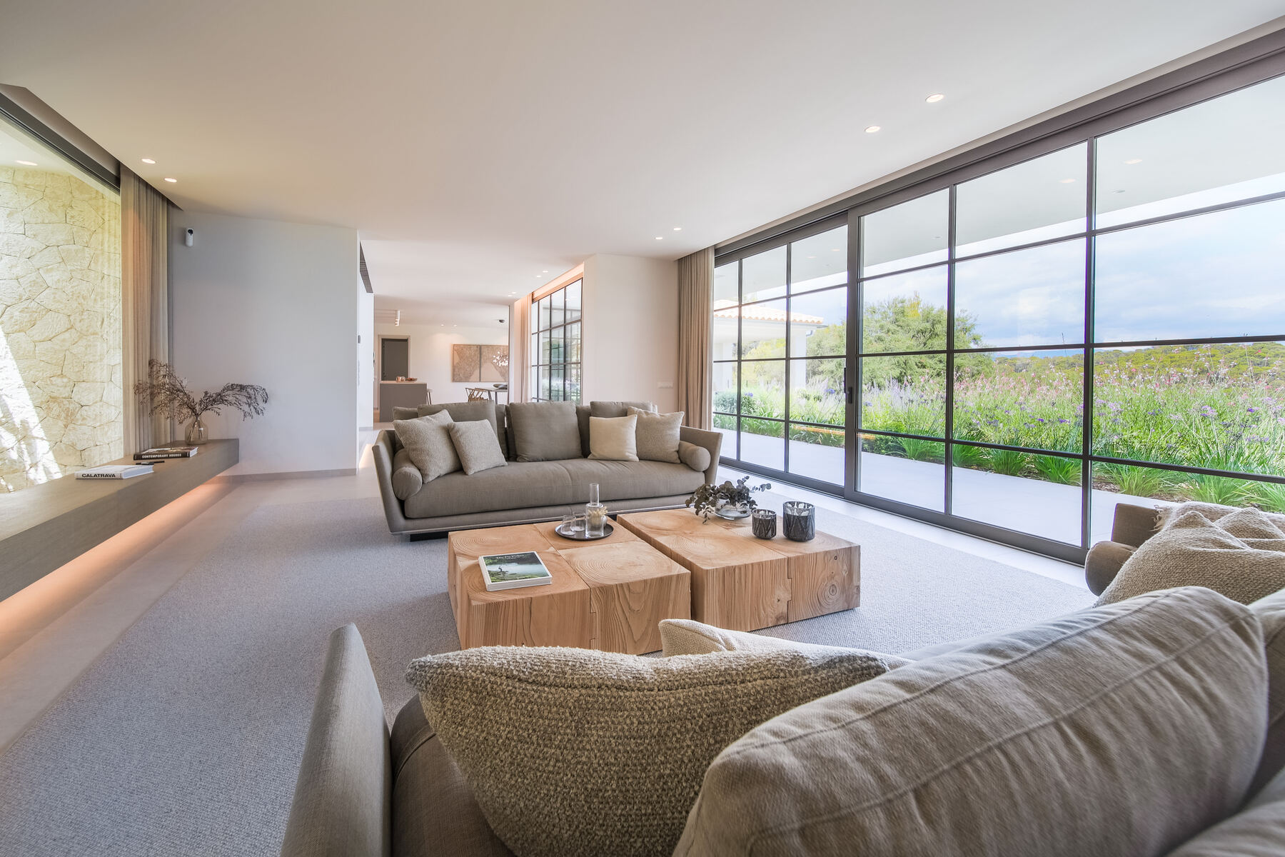 Living room with full-height glazing overlooking the garden